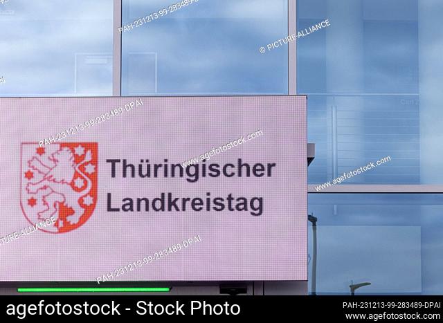 13 December 2023, Thuringia, Erfurt: The logo of the Thuringian County Association shines on a display during the County Assembly at the Congress Center Messe...