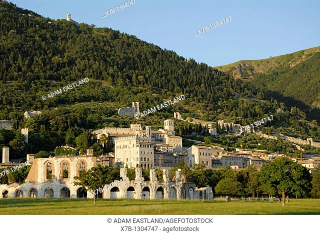Gubbio  Umbria  Italy  The remains of the Roman Theatre lower foreground and the medieval town on the slopes of Monte Ingino