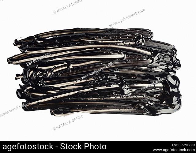 swatch of black smudged acrylic paint, smear isolated on white background, close up
