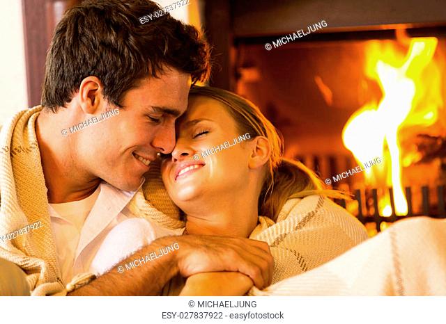 Couple Makes Passionate Love By The Fireplace