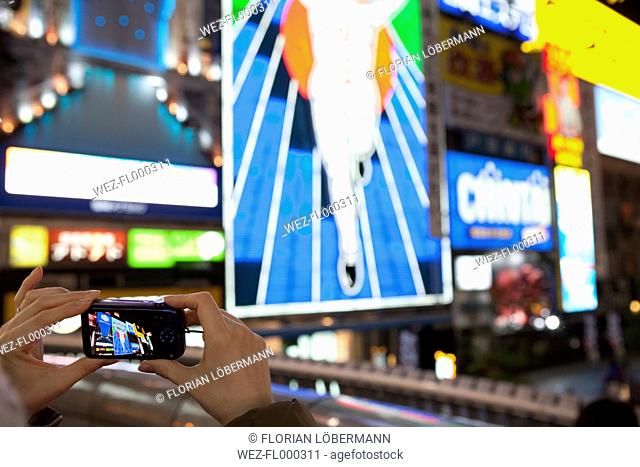 Japan, Osaka, Famous billboard being photographed