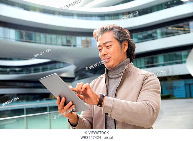 Business man with tablets