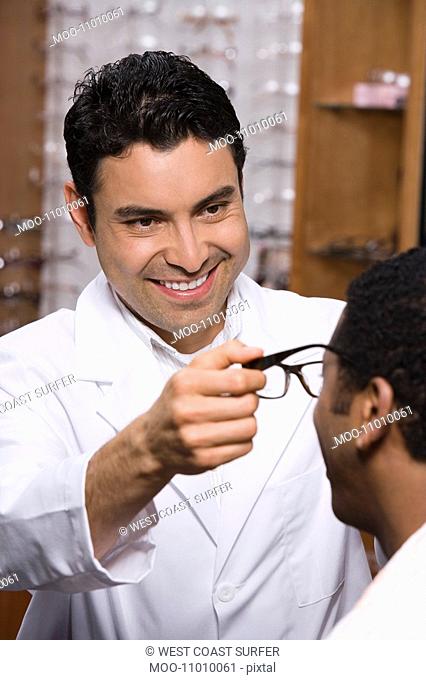 Optician helping customer