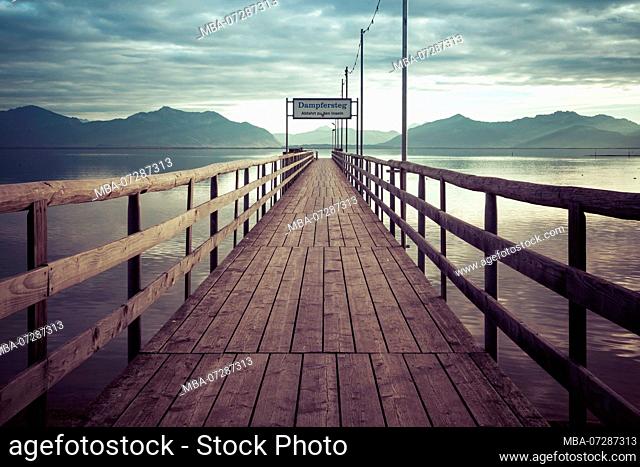 Steamer dock at Chiemsee with Alps, Seebruck, Bavaria, Germany