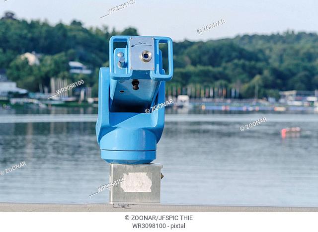 Stationary binoculars overlooking a lake