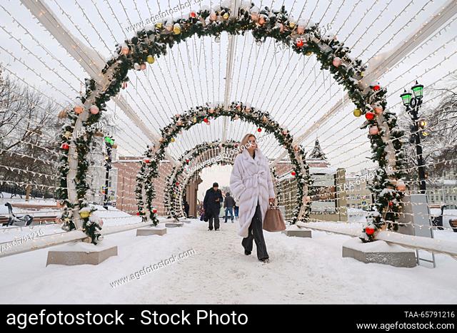 RUSSIA, MOSCOW - DECEMBER 15, 2023: A woman walks in central Moscow after a snowfall. Vladimir Gerdo/TASS