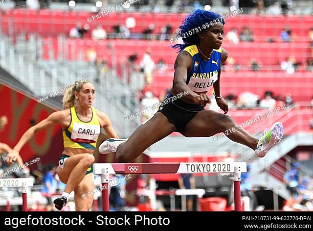 31 July 2021, Japan, Tokio: Athletics: Olympics, women, 400 m hurdles, heats at the Olympic Stadium. Tia-Adana Belle (r) from Barbados in action