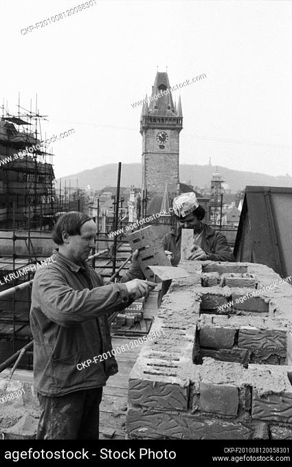 ***APRIL 16, 1987, FILE PHOTO*** Bricklayers Karel Koci (left) and Antonin Grosman during the reconstruction of the chimney of house No