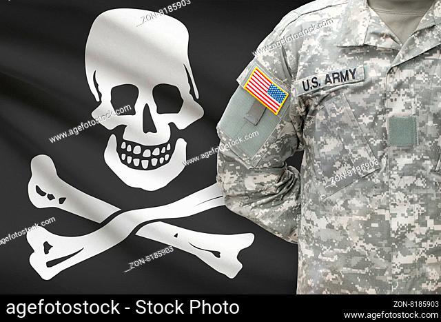 American soldier with flag on background - Jolly Roger - symbol of piracy