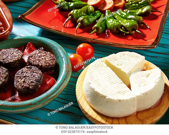 Tapas Morcilla and cheese de Burgos from Spain and padron peppers