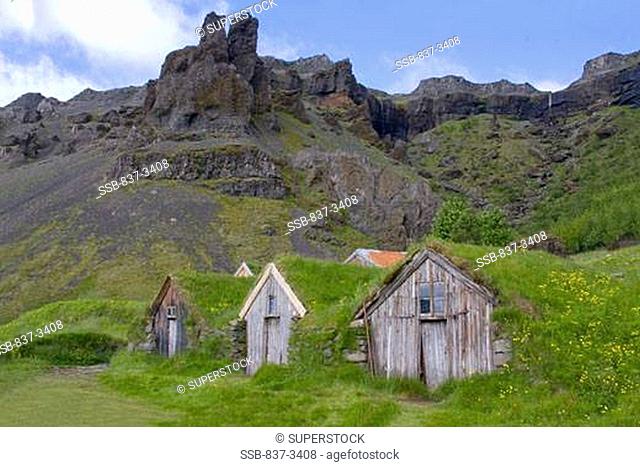 Old traditional turf farms at hillside, Iceland