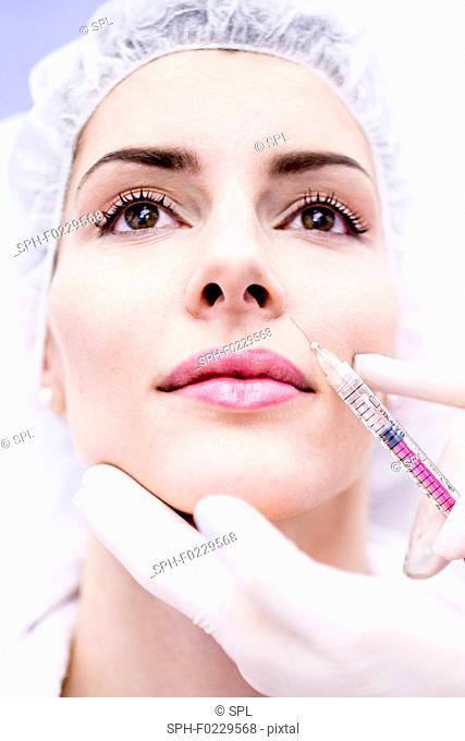 Woman having injection in face