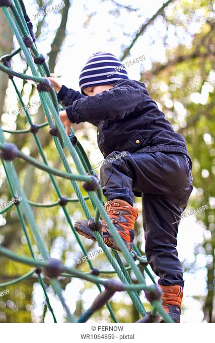 Toddler climbing on playground