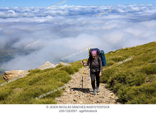 Woman practicing mountaineering in the Sierra de Béjar Natural Park, in Salamanca province, Biosphere Reserve of Sierra de Béjar and Francia