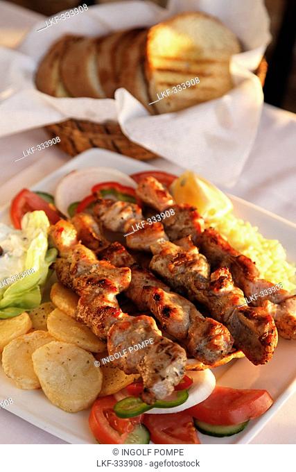 Greek dish Souvlaki, pork or lamb meat pieces grilled on skewers, Prefecture Lasithi, Crete, Greece