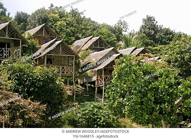 Wooden hillside bungalows on stilts at View Point Ko Lipe island Thailand