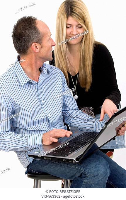 man and woman using laptop. - 19/11/2007