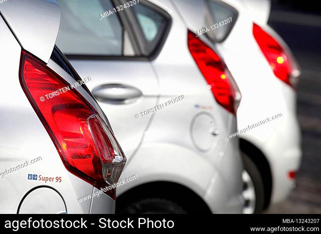 Red taillights on parked cars, Germany