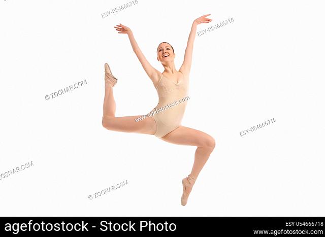 young modern ballet dancer jumping isolated on white background