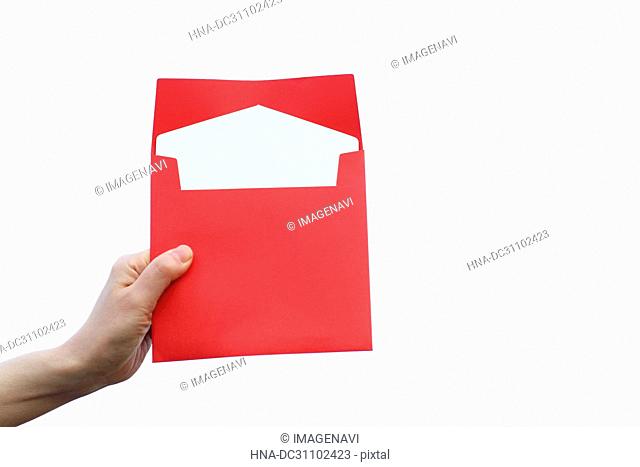 Woman Hand Holding Envelope of Invitation Card