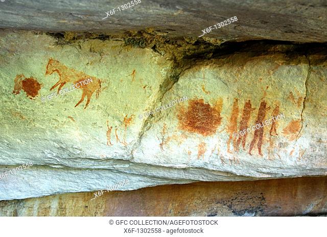 Prehistoric rock paintings of animals and a groupe of peersons by the San people along the Sevilla Rock Art Trail near Clanwilliam, Cederberg Mountains