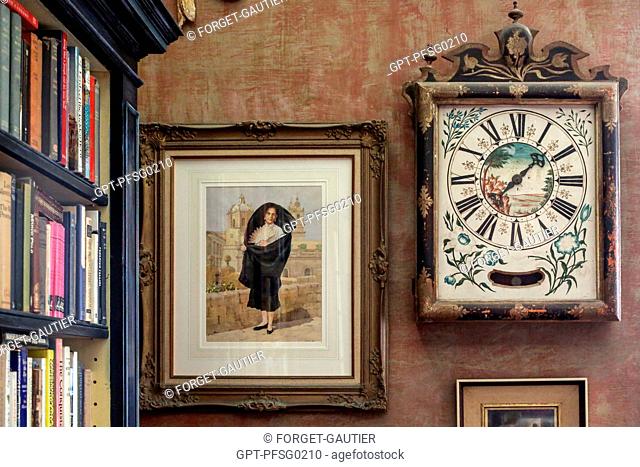 MALTESE CLOCK AND PAINTING OF A WOMAN IN TRADITIONAL DRESS, CASA ROCCA PICCOLA, VALLETTA, MALTA