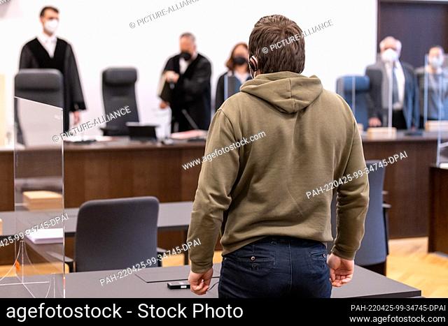 25 April 2022, Bavaria, Nuremberg: An accused man stands in the courtroom of the Criminal Justice Center of the Nuremberg-Fürth Regional Court as the trial...