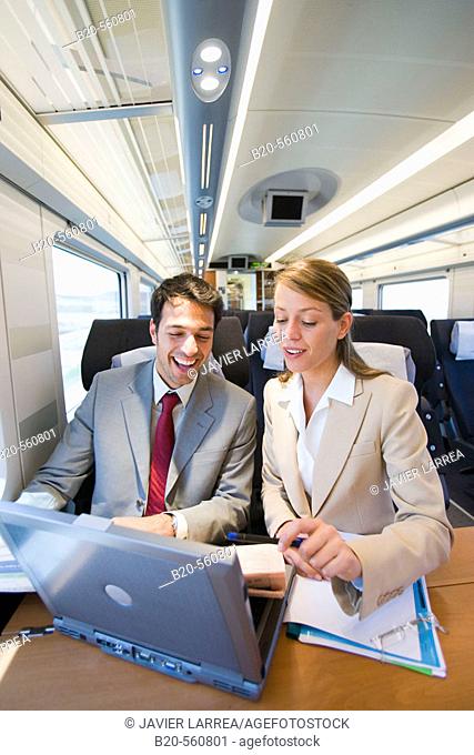 Businessmen working connected to the internet. Passenger. AVE, Tren de Alta Velocidad, Zaragoza, Aragón. Spain