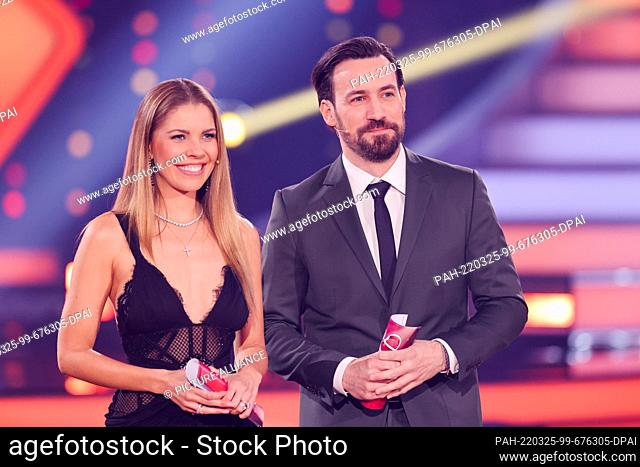25 March 2022, North Rhine-Westphalia, Cologne: Victoria Swarovski and Jan Köppen, presenters, stand in the RTL dance show ""Let's Dance"" in the Coloneum