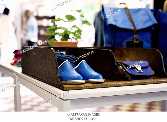Shoes and bags displayed at store