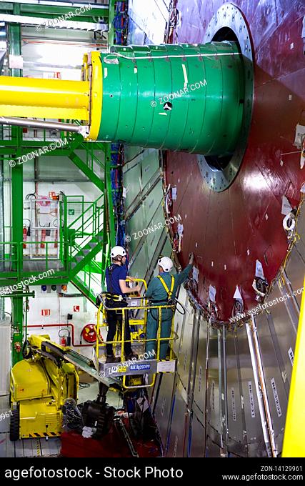CERN, France - 25 June, 2019: Workers repair part of The Large Hadron Collider (LHC) is seen underground inthe French part of CERN