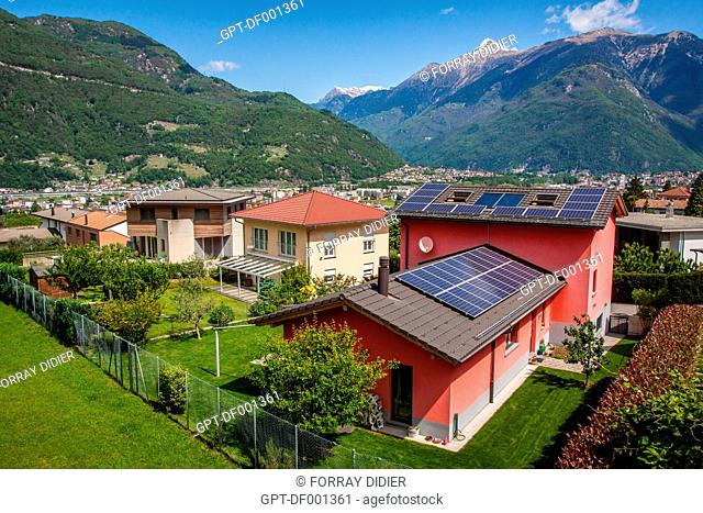 HOUSE WITH A ROOF COVERED IN PHOTOVOLTAIC SOLAR PANELS ON THE HEIGHTS OF THE CITY OF BELLINZONA, ENERGY TRANSITION, ECOLOGY, ELECTRICITY, BELLINZONA