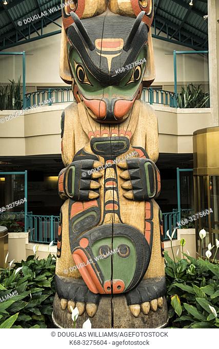 Totem pole in the Atrium of the Victoria Conference Centre in downtown Victoria, BC, Canada