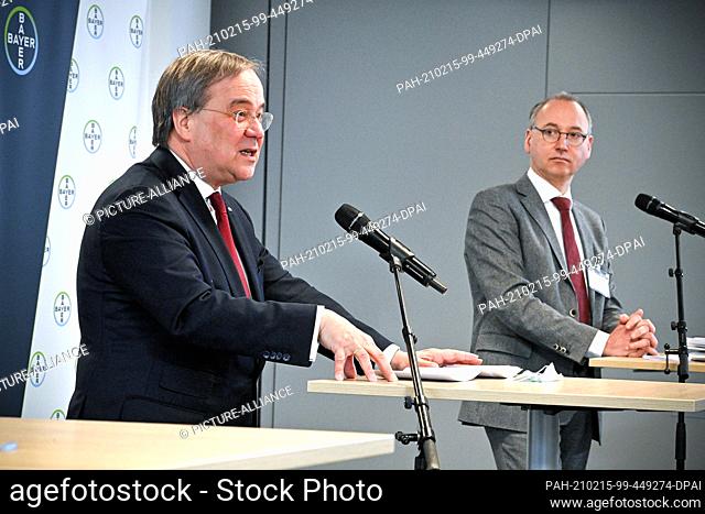 15 February 2021, North Rhine-Westphalia, Wuppertal: Armin Laschet (l, CDU), Minister President of North Rhine-Westphalia, and Werner Baumann
