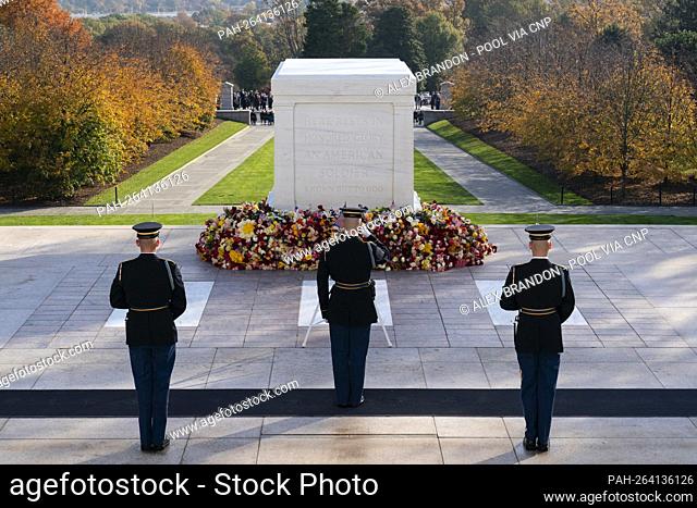 A tomb guard of the 3rd U.S. Infantry Regiment, known as ""The Old Guard, "" salutes during the changing of the guard during a centennial ceremony for the Tomb...