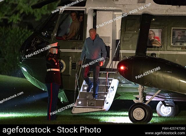 United States President Joe Biden steps down from Marine One as he arrives on the South Lawn of the White House in Washington