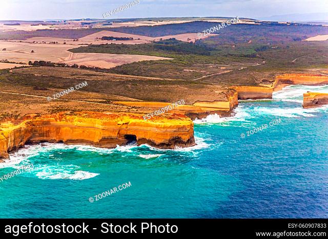 Scenic coastline. Great Ocean Road and the Twelve Apostles - group of limestone cliffs on Pacific coast. Australia. Picture taken from a helicopter