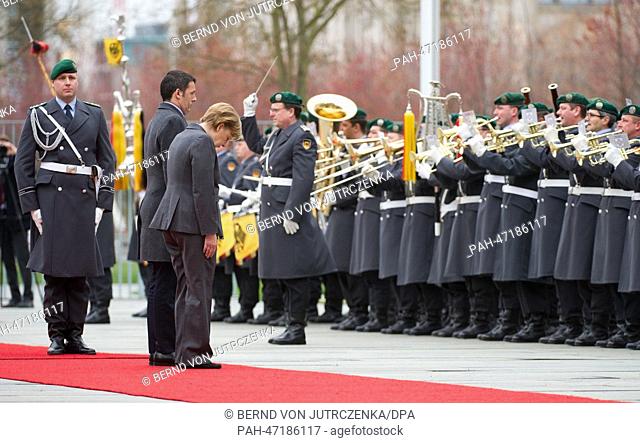New Italian Prime Minister Matteo Renzi is welcomed military honors by German Chancellor Angela Merkel (CDU) during his first official visit in front of the...