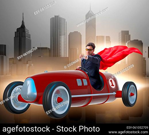 The superhero businessman driving vintage roadster
