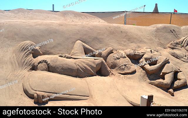 Sand sculpture depicting theater of war and dead soldiers