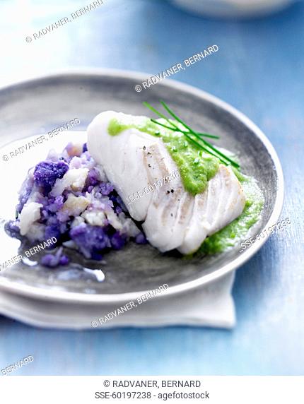 Piece of cod with creamy chive sauce, purple potato and celeriac mash