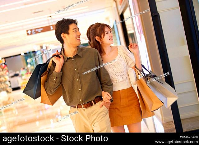 Young couples in the shopping mall