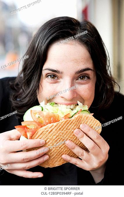 Woman Eating Sandwich