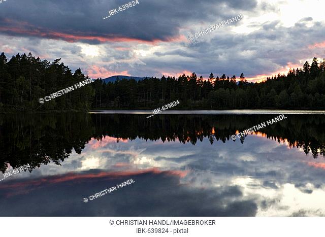 Sunset over a lake near Ormemyr, Telemark, Norway, Scandinavia, Europe