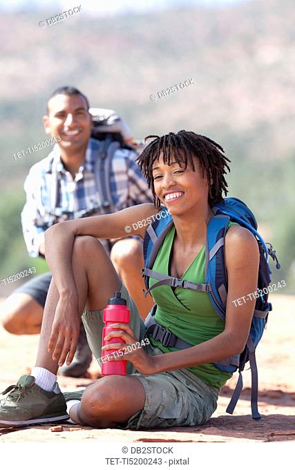 USA, Arizona, Sedona, Young couple hiking and enjoying desert scenery