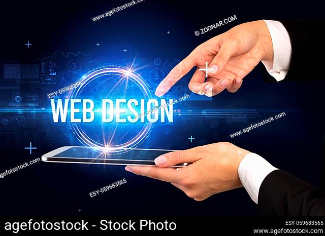 Close-up of a touchscreen with WEB DESIGN inscription, new technology concept