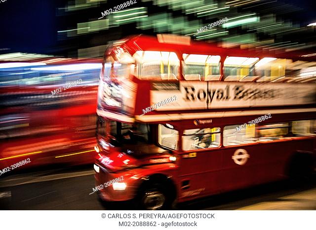 London's iconic bus at night, London, UK