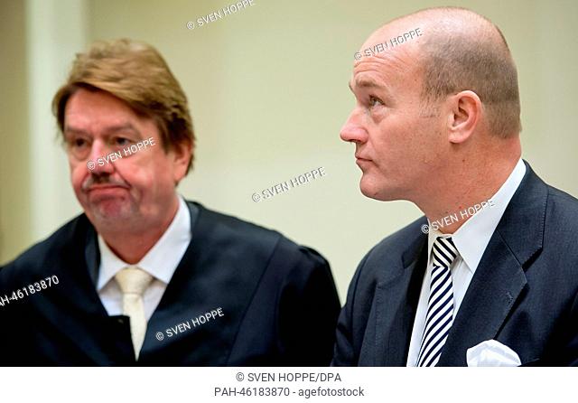 Former BayernLB chairman Gerhard Gribkowsky (R) stands together with his attorney Hermann Mayer in the courtroom at the beginning of the trial at the regional...