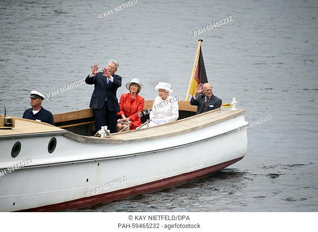 Queen Elizabeth II, Prince Philip, German President Joachim Guack (l) and his partner Daniela Schadt (2 from l) on a boat 'Ajax' sailing along the Spree