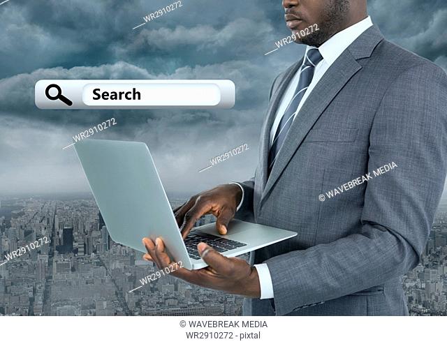 Businessman holding laptop with Search Bar with city background